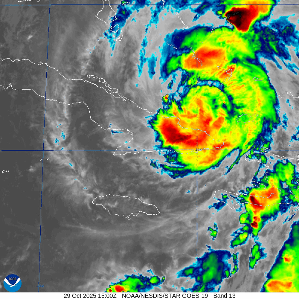 A satellite map of a hurricane in vibrant colors swirling over eastern Cuba. Dense cloud bands and the storm&rsquo;s defined movements appear against a gray grid background.
