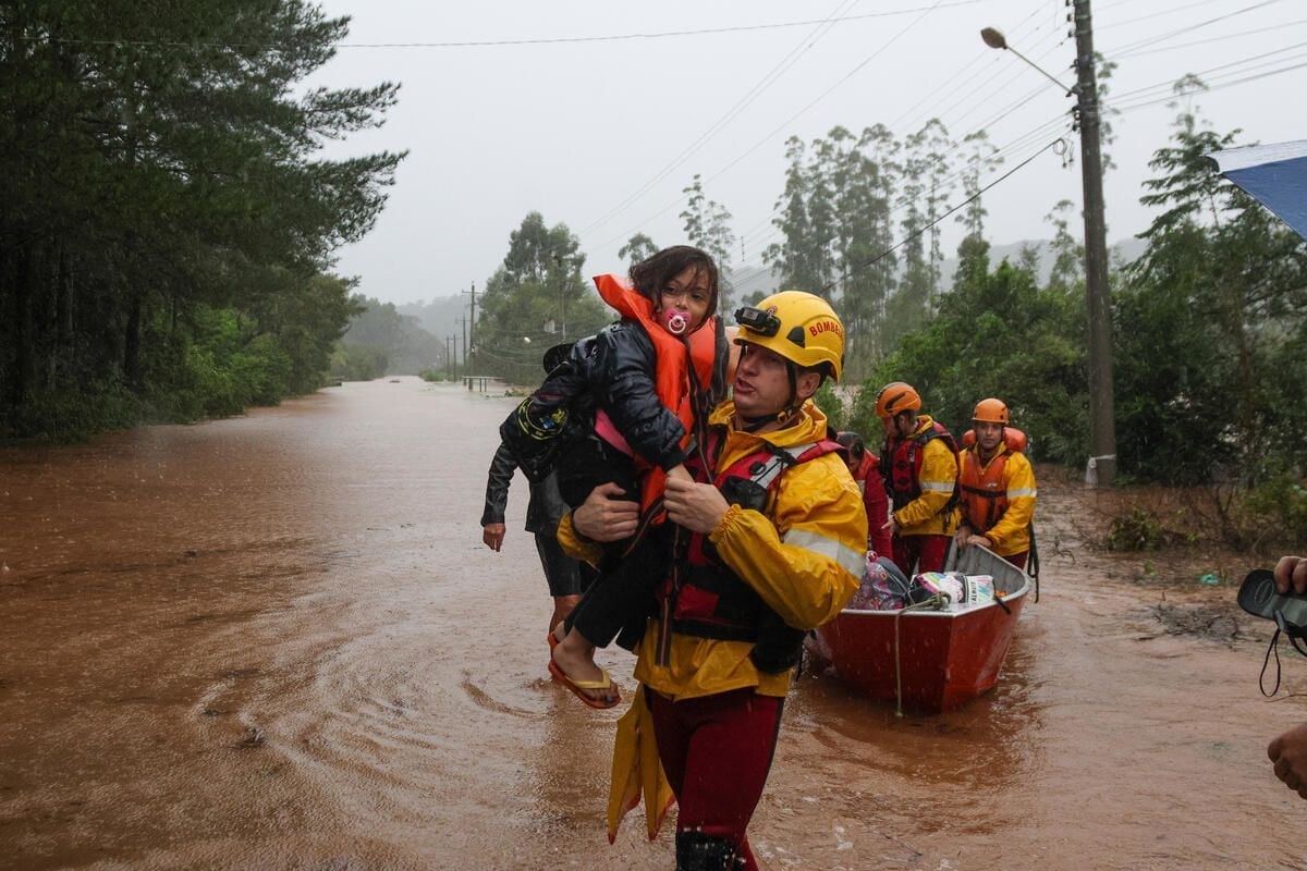 man carrying child